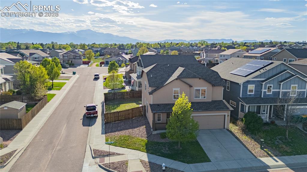 1944 Reed Grass Way, Colorado Springs, CO 80915 - aerial perspective of suburban area featuring mountains