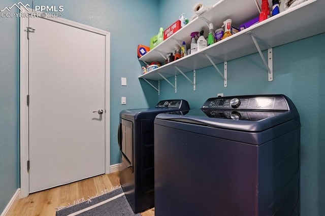5584 Calamity Jane Ln, Colorado Springs, CO 80923 - laundry room featuring washer and clothes dryer and light wood-type flooring