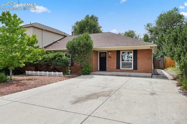 79 W Old Broadmoor Rd, Colorado Springs, CO 80906 - single story home with brick siding and a shingled roof