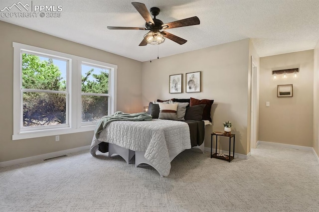 79 W Old Broadmoor Rd, Colorado Springs, CO 80906 - bedroom featuring light carpet, ceiling fan, and a textured ceiling