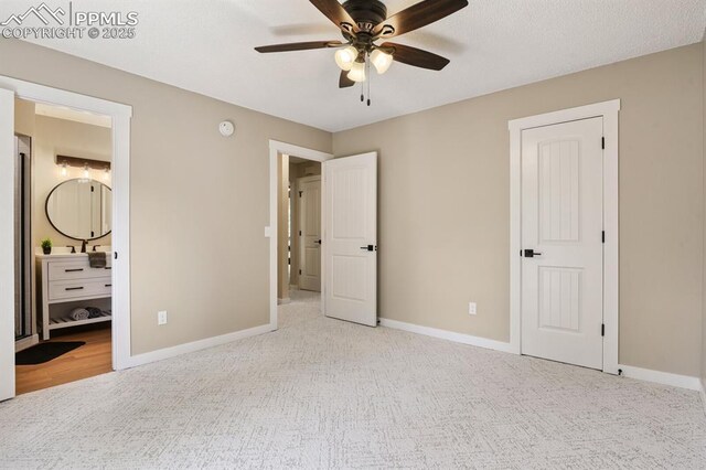 79 W Old Broadmoor Rd, Colorado Springs, CO 80906 - unfurnished bedroom with carpet floors, ensuite bath, and a ceiling fan