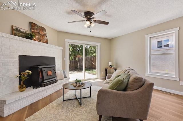 79 W Old Broadmoor Rd, Colorado Springs, CO 80906 - living area featuring a ceiling fan, light wood-style floors, and a textured ceiling