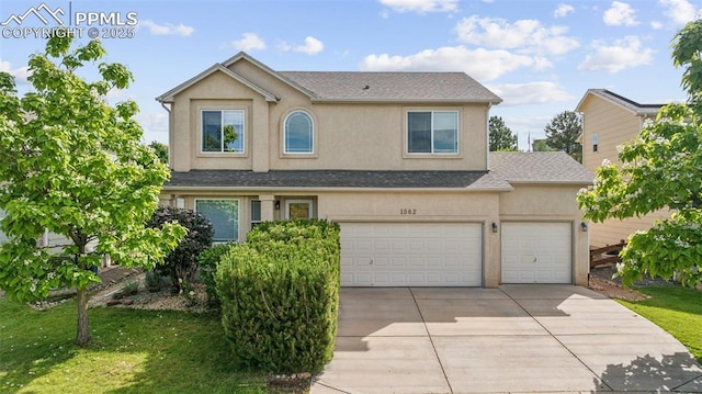 1562 Lookout Springs Dr, Colorado Springs, CO 80921 - traditional home featuring driveway, stucco siding, a front yard, and an attached garage
