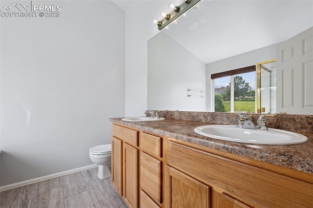 1562 Lookout Springs Dr, Colorado Springs, CO 80921 - bathroom featuring double vanity, a stall shower, and vaulted ceiling