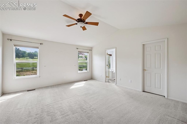 1562 Lookout Springs Dr, Colorado Springs, CO 80921 - unfurnished bedroom with vaulted ceiling, carpet, connected bathroom, and a ceiling fan