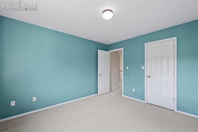 1562 Lookout Springs Dr, Colorado Springs, CO 80921 - unfurnished bedroom featuring baseboards and carpet flooring