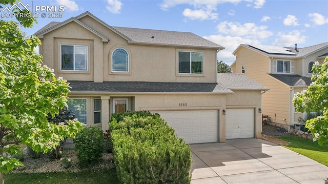 1562 Lookout Springs Dr, Colorado Springs, CO 80921 - traditional-style home with concrete driveway, stucco siding, and roof with shingles