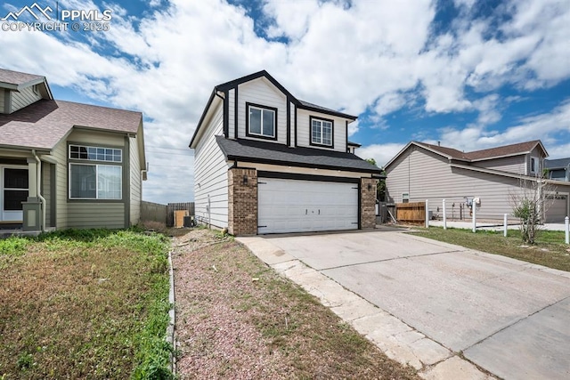 245 Turf Trail Pl, Fountain, CO 80817 - traditional home with brick siding, concrete driveway, and an attached garage