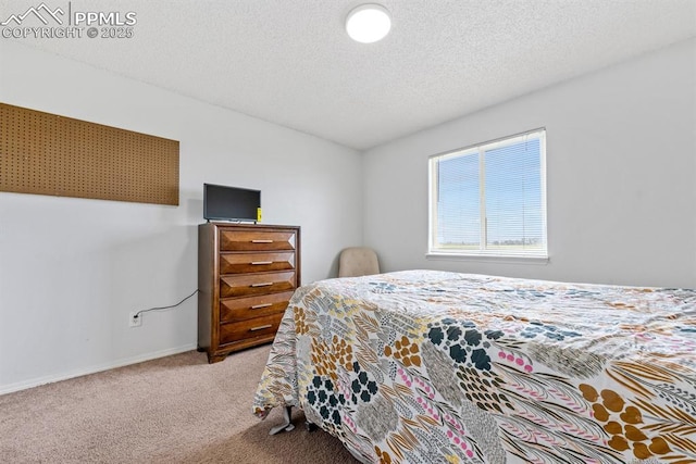 245 Turf Trail Pl, Fountain, CO 80817 - carpeted bedroom featuring a textured ceiling and baseboards