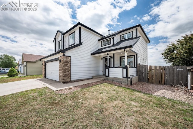 245 Turf Trail Pl, Fountain, CO 80817 - view of front of home with a porch, driveway, brick siding, and a garage