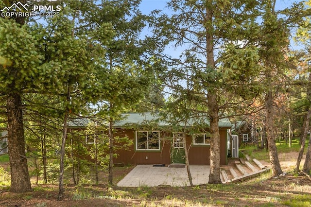 53 Iris Rd, Woodland Park, CO 80863 - back of property with a patio area