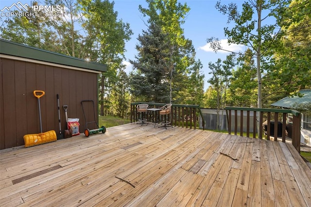 53 Iris Rd, Woodland Park, CO 80863 - wooden deck with view of scattered trees