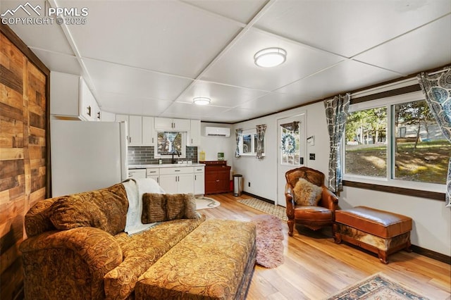 53 Iris Rd, Woodland Park, CO 80863 - living area with a wall mounted AC and light wood-style floors