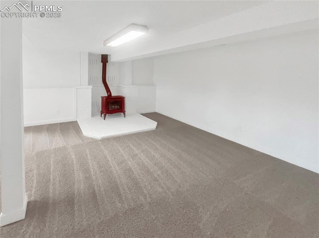 570 Ore Cart Way, Monument, CO 80132 - finished below grade area with a wood stove and carpet