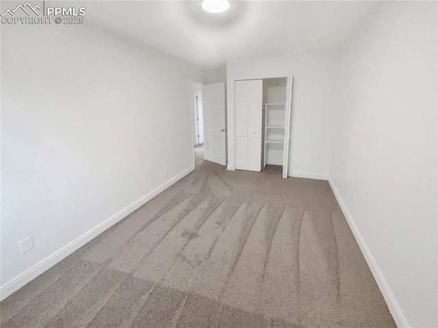 570 Ore Cart Way, Monument, CO 80132 - unfurnished bedroom featuring a closet and carpet