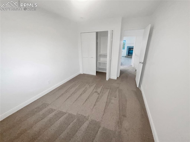 570 Ore Cart Way, Monument, CO 80132 - unfurnished bedroom with carpet and a closet