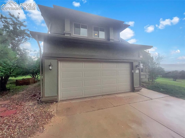 570 Ore Cart Way, Monument, CO 80132 - garage featuring driveway