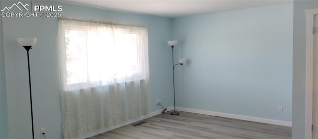 2118 N Chestnut St, Colorado Springs, CO 80907 - unfurnished room with light wood-style floors and baseboards