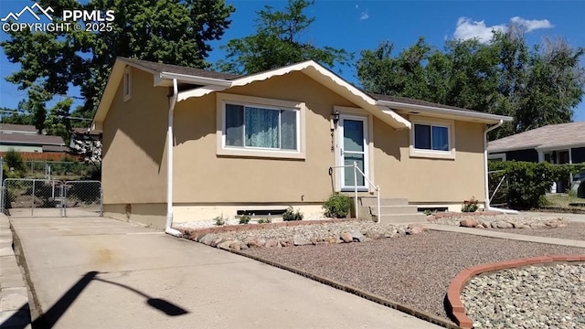 2118 N Chestnut St, Colorado Springs, CO 80907 - view of front of home featuring stucco siding and concrete driveway