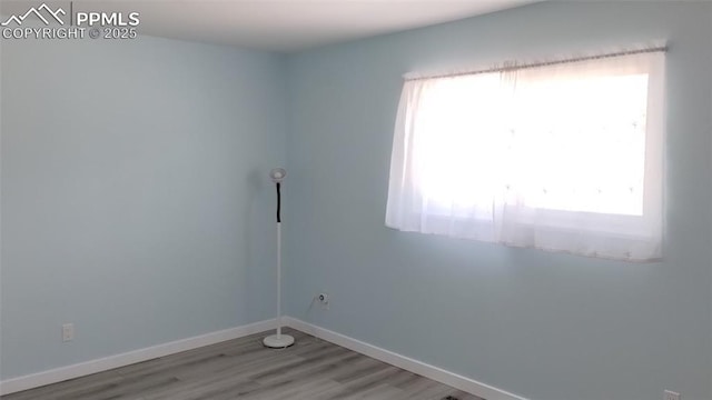 2118 N Chestnut St, Colorado Springs, CO 80907 - unfurnished room with healthy amount of natural light and wood finished floors