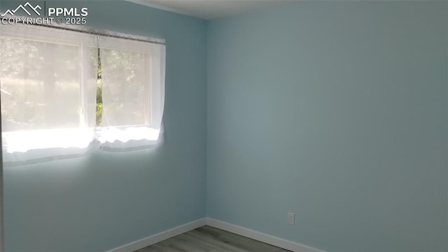 2118 N Chestnut St, Colorado Springs, CO 80907 - spare room with baseboards and wood finished floors