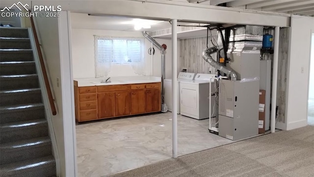 2118 N Chestnut St, Colorado Springs, CO 80907 - below grade area with independent washer and dryer, stairs, heating unit, and water heater