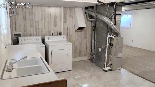 2118 N Chestnut St, Colorado Springs, CO 80907 - washroom featuring washing machine and clothes dryer, heating unit, and wooden walls