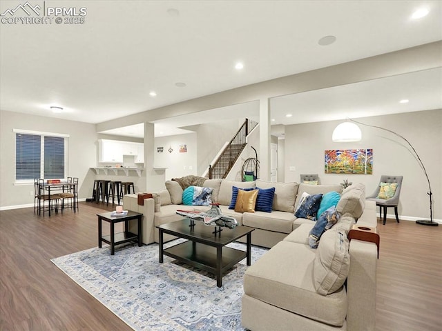 12646 Windingwalk Dr, Peyton, CO 80831 - living area with wood finished floors, stairs, and recessed lighting