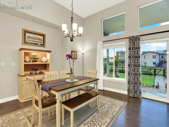 12646 Windingwalk Dr, Peyton, CO 80831 - dining area with dark wood finished floors and a chandelier