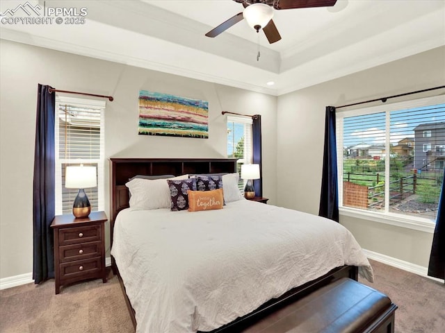 12646 Windingwalk Dr, Peyton, CO 80831 - bedroom with light carpet, crown molding, a ceiling fan, and a raised ceiling