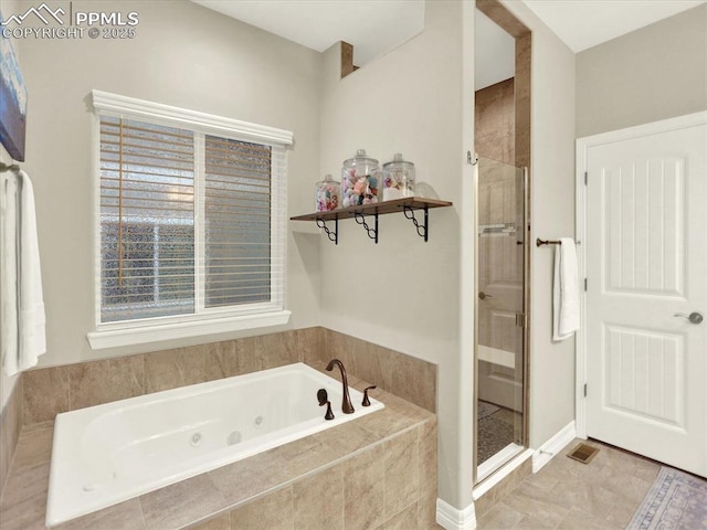 12646 Windingwalk Dr, Peyton, CO 80831 - full bathroom with a jetted tub and a stall shower