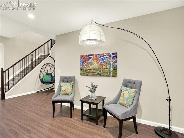 12646 Windingwalk Dr, Peyton, CO 80831 - living area featuring wood finished floors, stairway, and recessed lighting