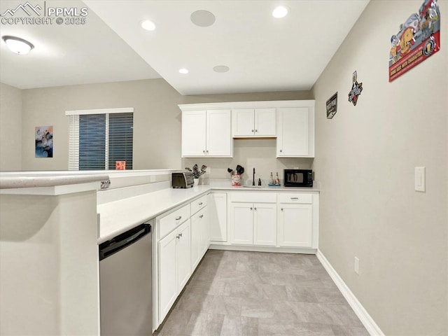 12646 Windingwalk Dr, Peyton, CO 80831 - kitchen featuring white cabinets, light countertops, recessed lighting, and a peninsula