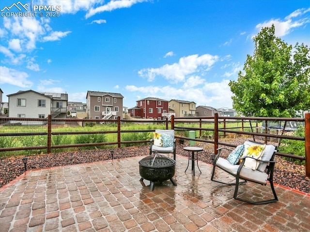 12646 Windingwalk Dr, Peyton, CO 80831 - view of patio with a residential view and an outdoor fire pit