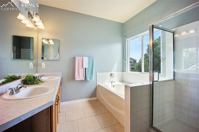 1880 Windover Ct, Fountain, CO 80817 - full bath featuring double vanity, a bath, a stall shower, tile patterned floors, and a chandelier