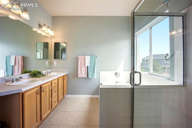 1880 Windover Ct, Fountain, CO 80817 - bathroom featuring double vanity, tile patterned floors, a tile shower, and a bathtub