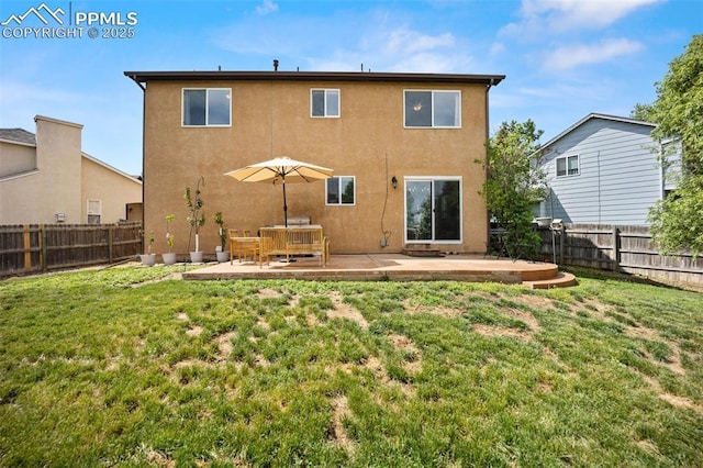 1880 Windover Ct, Fountain, CO 80817 - back of house featuring a patio area, stucco siding, and a fenced backyard