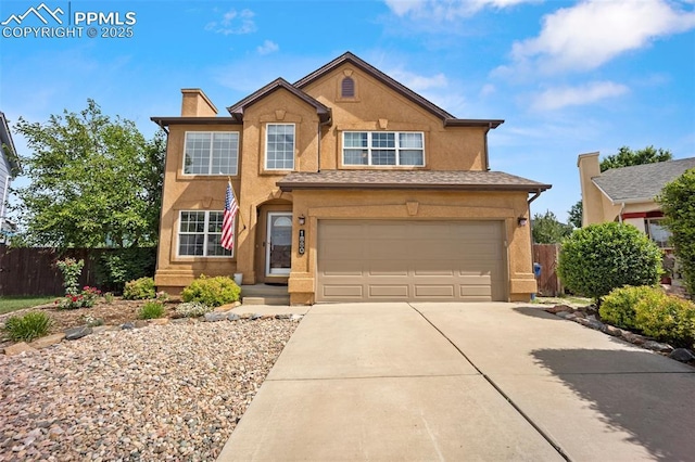 1880 Windover Ct, Fountain, CO 80817 - view of front of house featuring driveway, a chimney, stucco siding, and an attached garage
