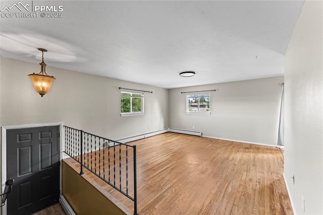 232 S Hancock Ave, Colorado Springs, CO 80903 - entrance foyer featuring wood finished floors and a baseboard radiator