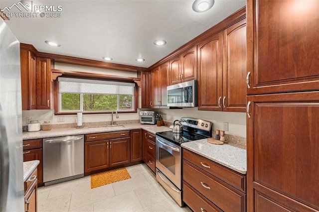 1105 Parkview Blvd, Colorado Springs, CO 80905 - kitchen featuring stainless steel appliances, light stone countertops, and recessed lighting