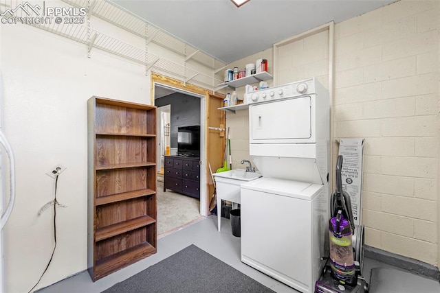 1105 Parkview Blvd, Colorado Springs, CO 80905 - washroom featuring stacked washing machine and dryer and concrete block wall