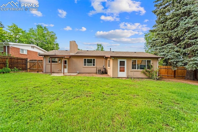 1105 Parkview Blvd, Colorado Springs, CO 80905 - back of property with a fenced backyard, a chimney, a patio, and stucco siding