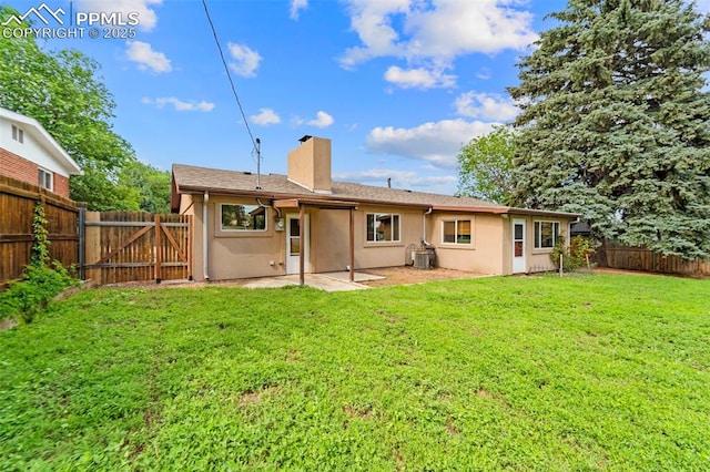 1105 Parkview Blvd, Colorado Springs, CO 80905 - back of property featuring a chimney, a fenced backyard, stucco siding, and a patio