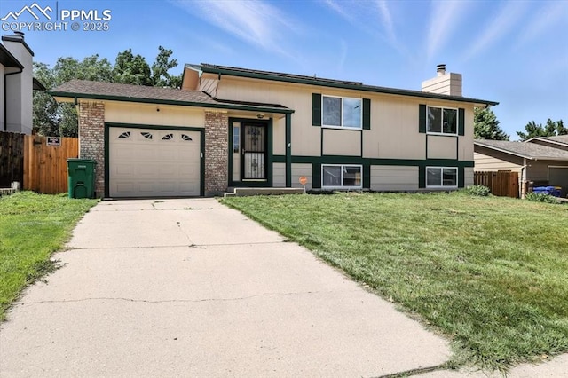 6880 Corn Tassle Dr, Colorado Springs, CO 80911 - view of front facade with a chimney, an attached garage, concrete driveway, and brick siding