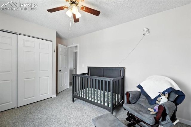 6880 Corn Tassle Dr, Colorado Springs, CO 80911 - carpeted bedroom featuring a textured ceiling, a ceiling fan, a closet, and a nursery area