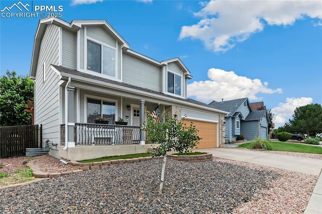 4914 Hawk Meadow Dr, Colorado Springs, CO 80916 - view of front of home featuring covered porch, concrete driveway, and a garage