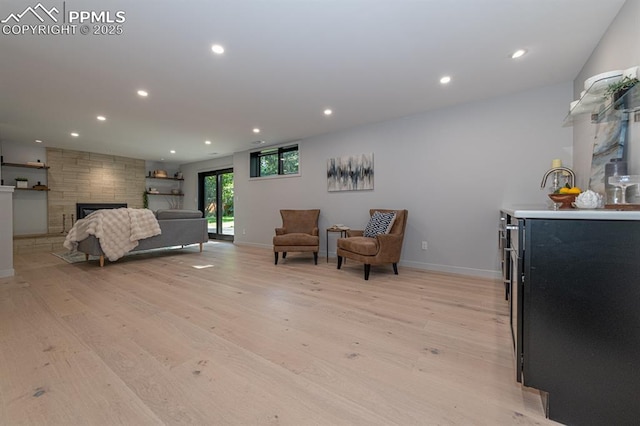 2510 Old Broadmoor Rd, Colorado Springs, CO 80906 - bedroom featuring light wood-type flooring, recessed lighting, and a fireplace