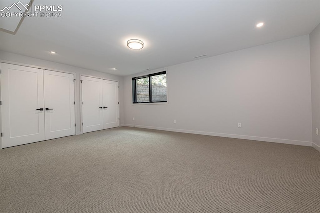2510 Old Broadmoor Rd, Colorado Springs, CO 80906 - unfurnished bedroom with multiple closets, recessed lighting, and light colored carpet