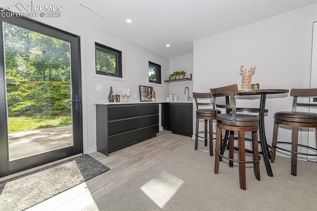 2510 Old Broadmoor Rd, Colorado Springs, CO 80906 - bar area featuring light wood finished floors, plenty of natural light, and recessed lighting