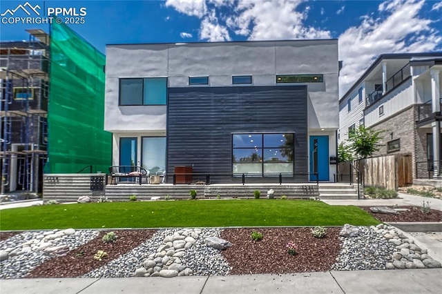 1231 Newton St, Denver, CO 80204 - contemporary house featuring a front yard